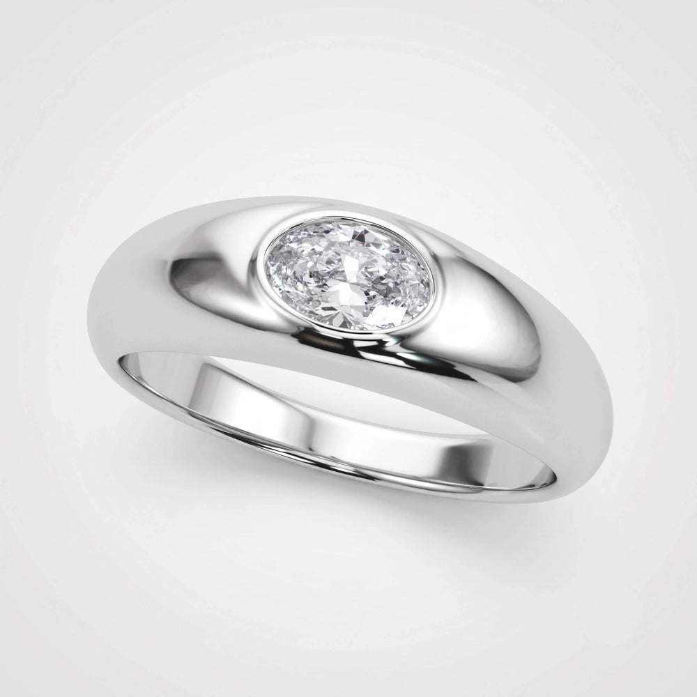 A polished silver-toned ring featuring a round brilliant-cut diamond set in a smooth, rounded bezel, shown on a light gray background.